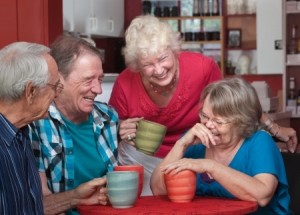 16926090 - group of laughing seniors in a coffeehouse