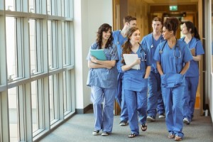 44764334 - medical students walking through corridor at the university